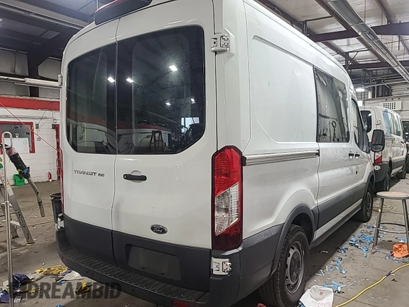 2018 Ford Transit z VIN 1FTYE1CM6JKB35871, wystawiony jako IAAI lot #42737736 z przebiegiem 199 396 mil mil oraz . Historia ofert i sprzedaży dostępna na DreamBid. Obrazek 21.
