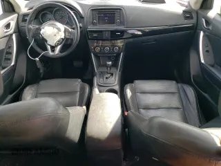 2013 Mazda CX-5 Grand Touring with VIN JM3KE4DE8D0102280, listed as a Copart auction lot 79750774 with 151,797 mi miles and Salvage Title. Bid and sale history available at DreamBid. Image 8.
