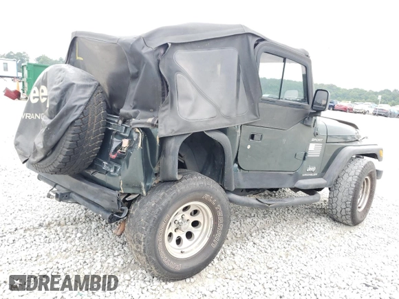 2003 Jeep Wrangler Sport with VIN 1J4FA49S03P330858, listed as a Copart auction lot 59519085 with Not provided miles and Salvage title. Bid and sale history available at DreamBid. Image 3.
