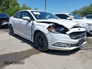 2018 Ford Fusion S z VIN 3FA6P0G7XJR224618, wystawiony jako IAAI lot #42213825 z przebiegiem 69 579 mil mil oraz . Historia ofert i sprzedaży dostępna na DreamBid. Obrazek 1.
