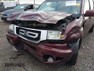 2010 Honda Ridgeline RTL with VIN 5FPYK1F57AB005602, listed as a IAAI auction lot 42208633 with 106,777 mi miles and . Bid and sale history available at DreamBid. Image 6.
