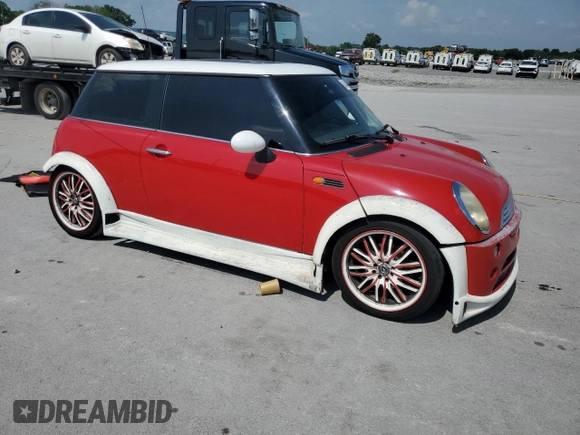 2004 MINI Hardtop with VIN WMWRC33444TC50103, listed as a Copart auction lot 63449615 with 144,467 mi miles and Salvage title. Bid and sale history available at DreamBid. Image 4.