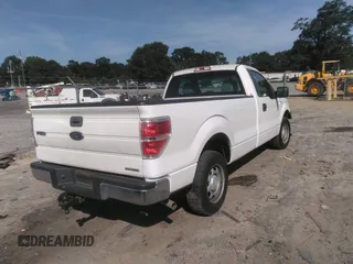 2014 Ford F-150 XL with VIN 1FTMF1CM0EKG51659, listed as a IAAI auction lot 42502648 with 99,450 mi miles and . Bid and sale history available at DreamBid. Image 4.