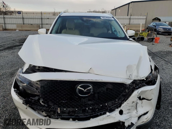 2020 Mazda CX-5 Touring with VIN JM3KFACM0L0863937, listed as a Copart auction lot 48240655 with 70,592 mi miles and Salvage Title. Bid and sale history available at carsss.com. Image 5.