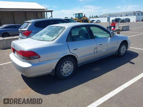 2002 Honda Accord LX with VIN 1HGCG56422A167829, listed as a IAAI auction lot 42401497 with 221,550 mi miles and . Bid and sale history available at DreamBid. Image 4.