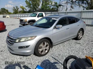 2010 Honda Crosstour EX-L z VIN 5J6TF1H57AL015526, wystawiony jako Copart lot #59127285 z przebiegiem 223 446 mil mil oraz Szkoda całkowita • Salvage title. Historia ofert i sprzedaży dostępna na DreamBid. Obrazek 1.