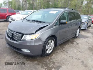 2013 Honda Odyssey Touring with VIN 5FNRL5H94DB013310, listed as a IAAI auction lot 42079565 with 128,622 mi miles and . Bid and sale history available at carsss.com. Image 2.