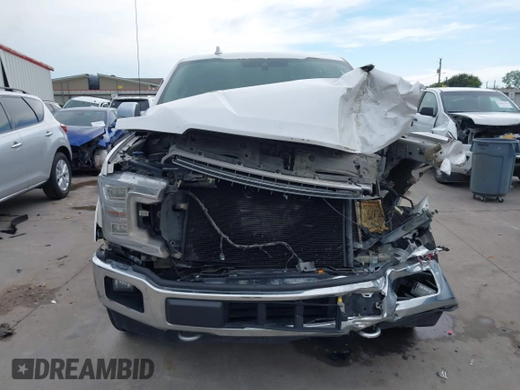 2018 Ford F-150 XL z VIN 1FTEW1EG1JKC32919, wystawiony jako IAAI lot #42486820 z przebiegiem 166 382 mil mil oraz . Historia ofert i sprzedaży dostępna na DreamBid. Obrazek 6.