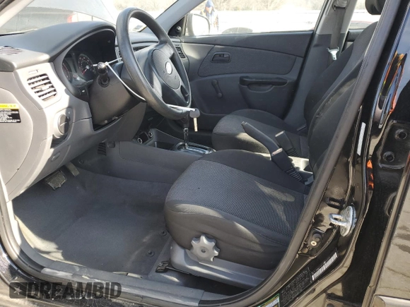 2010 Kia Rio LX with VIN KNADH4A3XA6652808, listed as a Copart auction lot 42597245 with 164,768 mi miles and Salvage Title. Bid and sale history available at carsss.com. Image 7.
