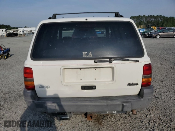 1996 Jeep Grand Cherokee Laredo z VIN 1J4EX58S3TC144191, wystawiony jako Copart lot #53153495 z przebiegiem 197 853 mil mil oraz Szkoda całkowita • Salvage title. Historia ofert i sprzedaży dostępna na DreamBid. Obrazek 6.