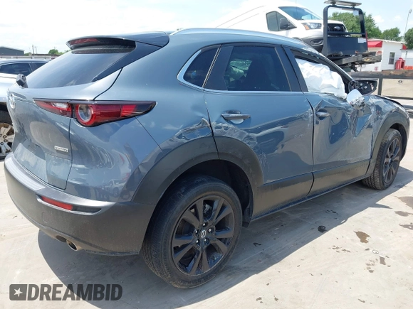 2022 Mazda CX-30 S Carbon Edition with VIN 3MVDMBCL6NM410330, listed as a IAAI auction lot 42107426 with 30,277 mi miles and . Bid and sale history available at DreamBid. Image 4.
