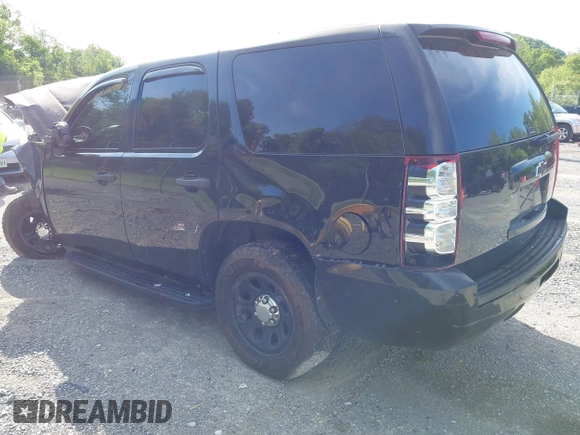 2013 Chevrolet Tahoe Commercial with VIN 1GNLC2E00DR265941, listed as a IAAI auction lot 42289977 with 206,840 mi miles and . Bid and sale history available at DreamBid. Image 3.