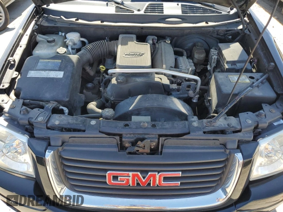 2005 GMC Envoy SLE z VIN 1GKDT13S752390266, wystawiony jako Copart lot #50766935 z przebiegiem 115 225 mil mil oraz Szkoda całkowita • Salvage title. Historia ofert i sprzedaży dostępna na DreamBid. Obrazek 13.