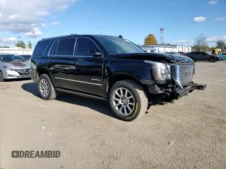 2016 GMC Yukon Denali with VIN 1GKS1CKJXGR329103, listed as a Copart auction lot 75492494 with 124,374 mi miles and Salvage Title. Bid and sale history available at carsss.com. Image 12.