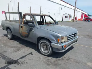 1993 Toyota T100 DX z VIN JT4VD10A7P0013959, wystawiony jako IAAI lot #42455083 z przebiegiem Nie podano mil oraz . Historia ofert i sprzedaży dostępna na DreamBid. Obrazek 1.
