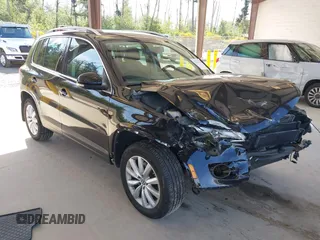 2011 Volkswagen Tiguan SE with VIN WVGBV7AX3BW557852, listed as a IAAI auction lot 42233723 with 98,561 mi miles and . Bid and sale history available at DreamBid. Image 1.