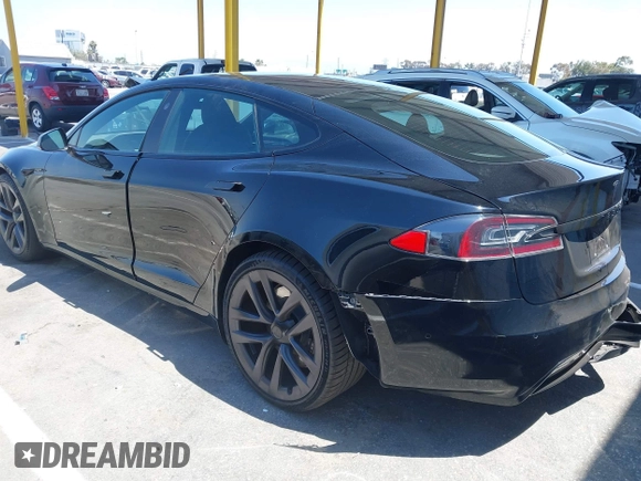2021 Tesla Model S Long Range z VIN 5YJSA1E54MF429360, wystawiony jako IAAI lot #42662440 z przebiegiem 36 395 mil mil oraz . Historia ofert i sprzedaży dostępna na DreamBid. Obrazek 3.