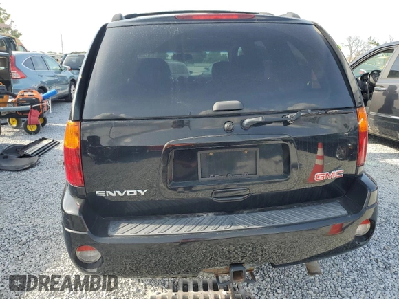 2006 GMC Envoy SLE z VIN 1GKDS13S062176000, wystawiony jako Copart lot #57672995 z przebiegiem 161 455 mil mil oraz Szkoda całkowita • Salvage title. Historia ofert i sprzedaży dostępna na DreamBid. Obrazek 6.