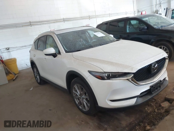 2019 Mazda CX-5 Grand Touring with VIN JM3KFBDM5K0520852, listed as a IAAI auction lot 42686818 with 36,800 mi miles and . Bid and sale history available at DreamBid. Image 1.