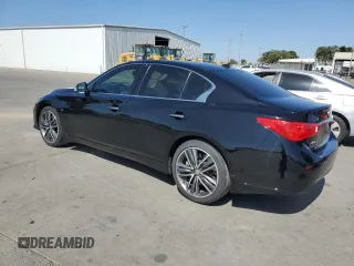 2014 Infiniti Q50 Premium with VIN JN1BV7ARXEM687605, listed as a Copart auction lot 61275535 with 104,337 mi miles and Salvage title. Bid and sale history available at DreamBid. Image 2.