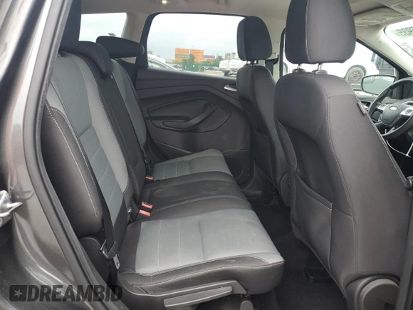 2016 Ford Escape SE z VIN 1FMCU9G97GUB40023, wystawiony jako Copart lot #61405935 z przebiegiem 107 591 mil mil oraz Czysty tytuł • Clean title. Historia ofert i sprzedaży dostępna na DreamBid. Obrazek 11.