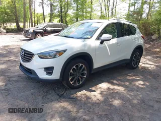 2016 Mazda CX-5 Grand Touring with VIN JM3KE2DY0G0870077, listed as a IAAI auction lot 42158225 with 93,816 mi miles. Bid and sale history available at carsss.com. Image 17.