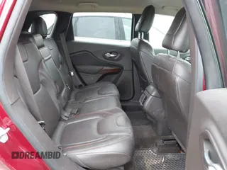 2015 Jeep Cherokee Trailhawk with VIN 1C4PJMBS6FW575517, listed as a IAAI auction lot 42661199 with 299,166 mi miles and . Bid and sale history available at DreamBid. Image 8.