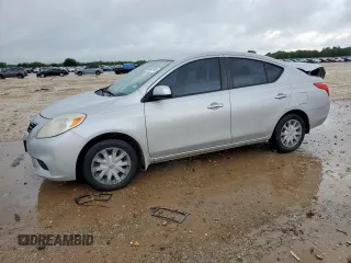 2012 Nissan Versa SV with VIN 3N1CN7AP3CL940595, listed as a Copart auction lot 60862945 with 144,886 mi miles and Salvage title. Bid and sale history available at DreamBid. Image 1.