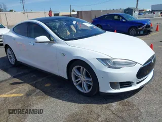 2015 Tesla Model S 85D with VIN 5YJSA1E22FF114484, listed as a IAAI auction lot 41857004 with 179,271 mi miles. Bid and sale history available at carsss.com. Image 1.