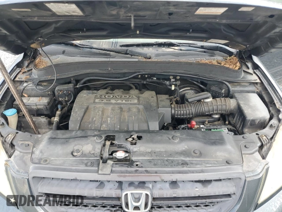 2005 Honda Pilot EX-L z VIN 2HKYF18705H564606, wystawiony jako Copart lot #55747785 z przebiegiem 272 432 mil mil oraz Szkoda całkowita • Salvage title. Historia ofert i sprzedaży dostępna na DreamBid. Obrazek 11.