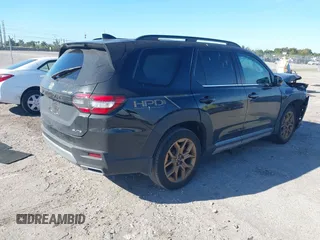 2023 Honda Pilot Elite with VIN 5FNYG1H87PB045057, listed as a IAAI auction lot 41748553 with 44,329 mi miles and . Bid and sale history available at DreamBid. Image 4.
