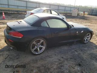 2011 BMW Z4 sDrive35i with VIN WBALM7C5XBE383093, listed as a Copart auction lot 74487034 with 0 mi miles and Salvage Title. Bid and sale history available at carsss.com. Image 3.