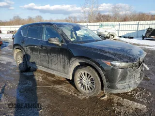 2017 Mazda CX-5 Touring with VIN JM3KFBCL0H0148970, listed as a Copart auction lot 42413605 with 57,776 mi miles and Salvage Title. Bid and sale history available at carsss.com. Image 4.