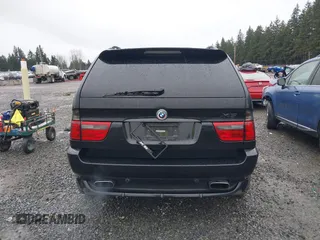 2005 BMW X5 4.8is with VIN 5UXFA93515LE82570, listed as a IAAI auction lot 41759657 with 212,687 mi miles. Bid and sale history available at carsss.com. Image 16.