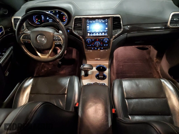 2015 Jeep Grand Cherokee Overland with VIN 1C4RJFCG7FC911899, listed as a Copart auction lot 54123925 with 243,031 mi miles and Salvage Title. Bid and sale history available at carsss.com. Image 8.