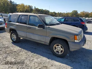 1998 Jeep Grand Cherokee Laredo with VIN 1J4GZ58S5WC165213, listed as a Copart auction lot 77611434 with 168,688 mi miles and Salvage Title. Bid and sale history available at carsss.com. Image 4.