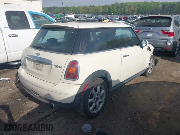 2007 MINI Hardtop with VIN WMWMF33587TT52466, listed as a IAAI auction lot 41964371 with 129,842 mi miles and . Bid and sale history available at DreamBid. Image 4.