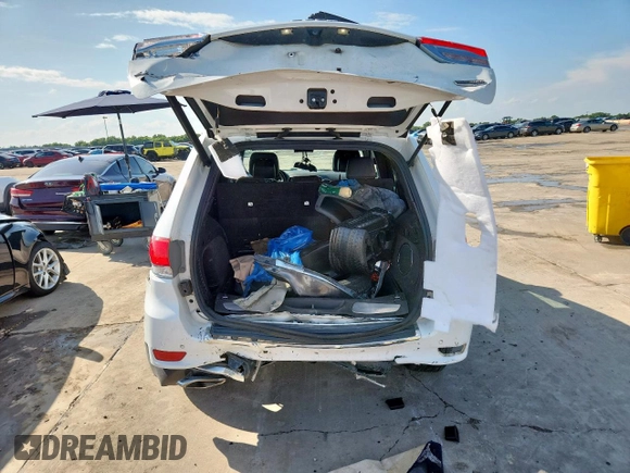 2014 Jeep Grand Cherokee Summit with VIN 1C4RJFJG9EC338666, listed as a Copart auction lot 63834075 with 196,840 mi miles and Salvage title. Bid and sale history available at DreamBid. Image 6.