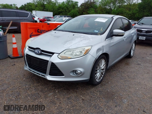 2012 Ford Focus SEL with VIN 1FAHP3H22CL102110, listed as a IAAI auction lot 41963966 with 151,538 mi miles. Bid and sale history available at carsss.com. Image 2.