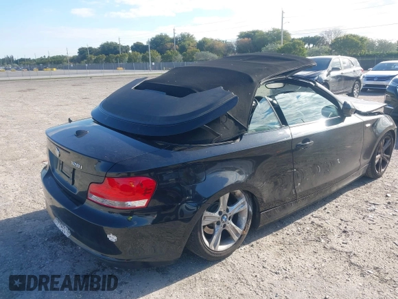 2011 BMW 1 Series 128i with VIN WBAUL7C54BVM80474, listed as a IAAI auction lot 42031032 with 76,617 mi miles and . Bid and sale history available at carsss.com. Image 4.