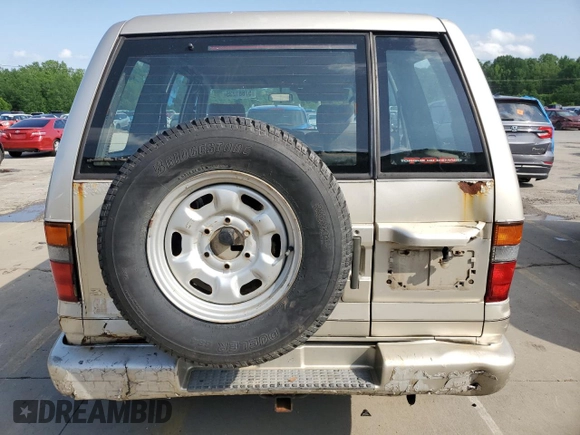 1999 Isuzu Trooper S with VIN JACDJ58X6X7924973, listed as a Copart auction lot 57881235 with 269,301 mi miles and Salvage title. Bid and sale history available at DreamBid. Image 6.