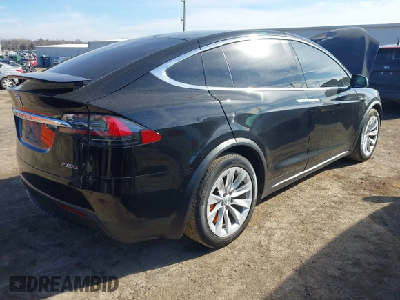 2018 Tesla Model X 75D with VIN 5YJXCDE44JF091690, listed as a IAAI auction lot 41585617 with 128,826 mi miles and . Bid and sale history available at DreamBid. Image 4.