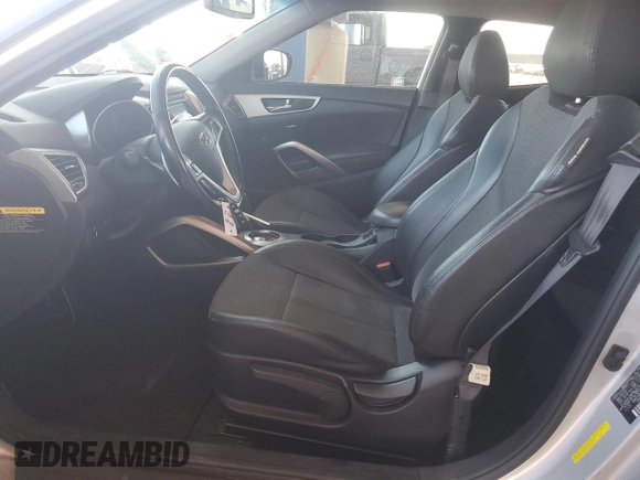 2014 Hyundai Veloster z VIN KMHTC6AD7EU216819, wystawiony jako Copart lot #57135335 z przebiegiem 104 588 mil mil oraz Szkoda całkowita • Salvage title. Historia ofert i sprzedaży dostępna na DreamBid. Obrazek 7.