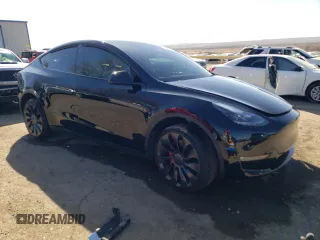 2023 Tesla Model Y Performance with VIN 7SAYGDEF3PF773031, listed as a Copart auction lot 47105765 with 25,604 mi miles and Salvage Title. Bid and sale history available at DreamBid. Image 4.