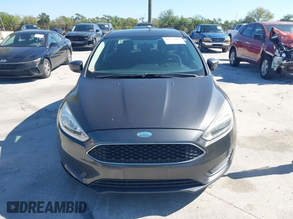 2018 Ford Focus SE z VIN 1FADP3F27JL245603, wystawiony jako IAAI lot #41773395 z przebiegiem 94 044 mil mil oraz . Historia ofert i sprzedaży dostępna na DreamBid. Obrazek 12.