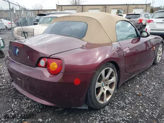 2004 BMW Z4 2.5i with VIN 4USBT33544LS50607, listed as a IAAI auction lot 41673776 with 156,585 mi miles. Bid and sale history available at carsss.com. Image 4.