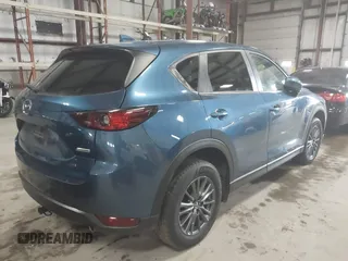 2019 Mazda CX-5 Touring with VIN JM3KFBCM1K0584369, listed as a IAAI auction lot 41657765 with 77,934 mi miles. Bid and sale history available at carsss.com. Image 4.