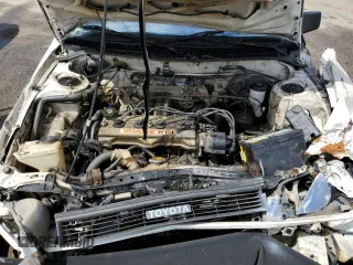 1990 Toyota Corolla z VIN JT2AE94A5L3323663, wystawiony jako Copart lot #71963834 z przebiegiem 354 386 mil mil oraz Szkoda całkowita • Salvage title. Historia ofert i sprzedaży dostępna na DreamBid. Obrazek 11.