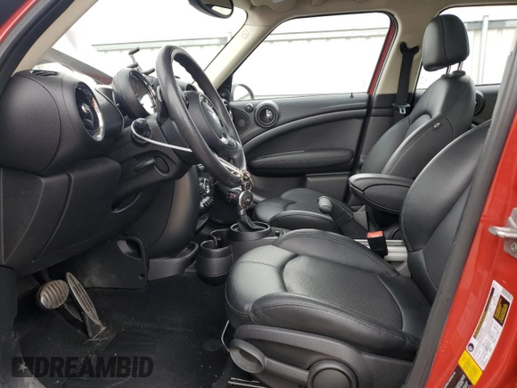 2016 MINI Countryman S with VIN WMWZC5C51GWU01015, listed as a Copart auction lot 51223155 with 74,602 mi miles and Salvage Title. Bid and sale history available at DreamBid. Image 7.