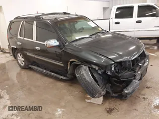 2004 GMC Envoy SLE with VIN 1GKDT13S642381802, listed as a IAAI auction lot 41723854 with 212,283 mi miles. Bid and sale history available at carsss.com. Image 1.